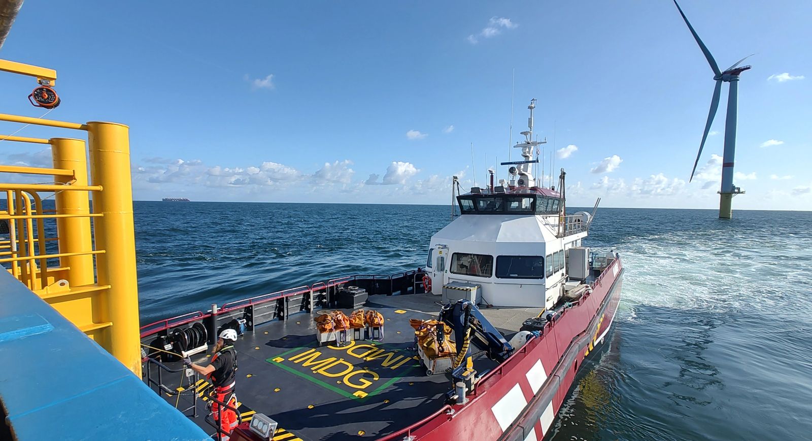 Service operation vessel alongside offshore wind turbine